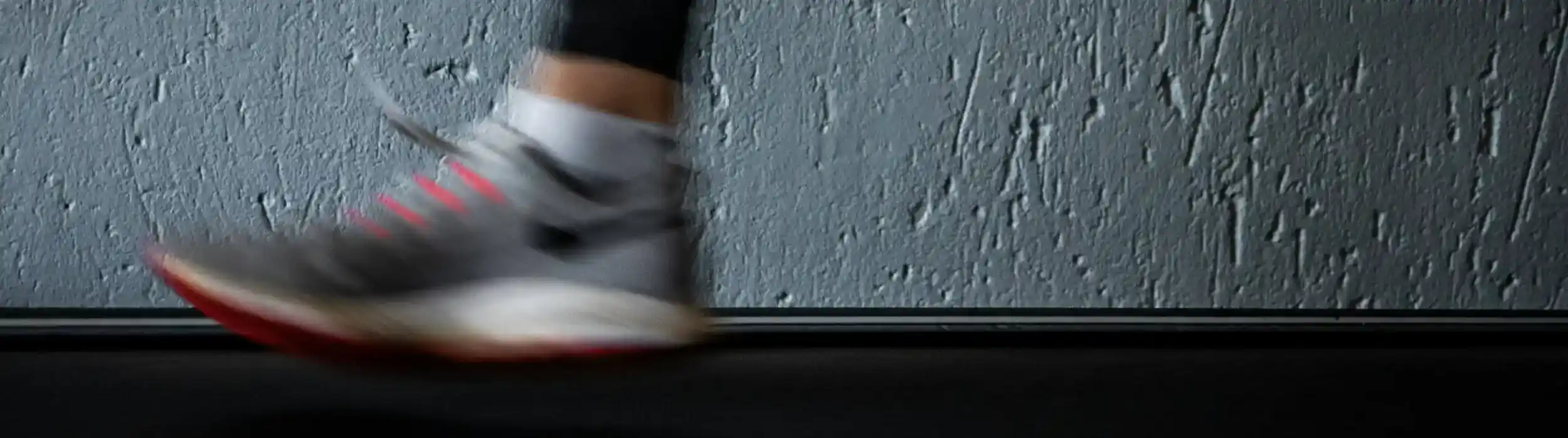 closeup of shoe running on treadmill